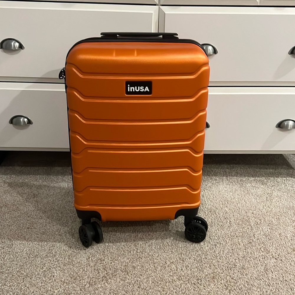 orange mini inUSA carry on suitcase.